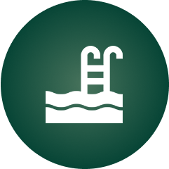 Icon of a swimming pool with a ladder, depicted in white against a solid green circular background.