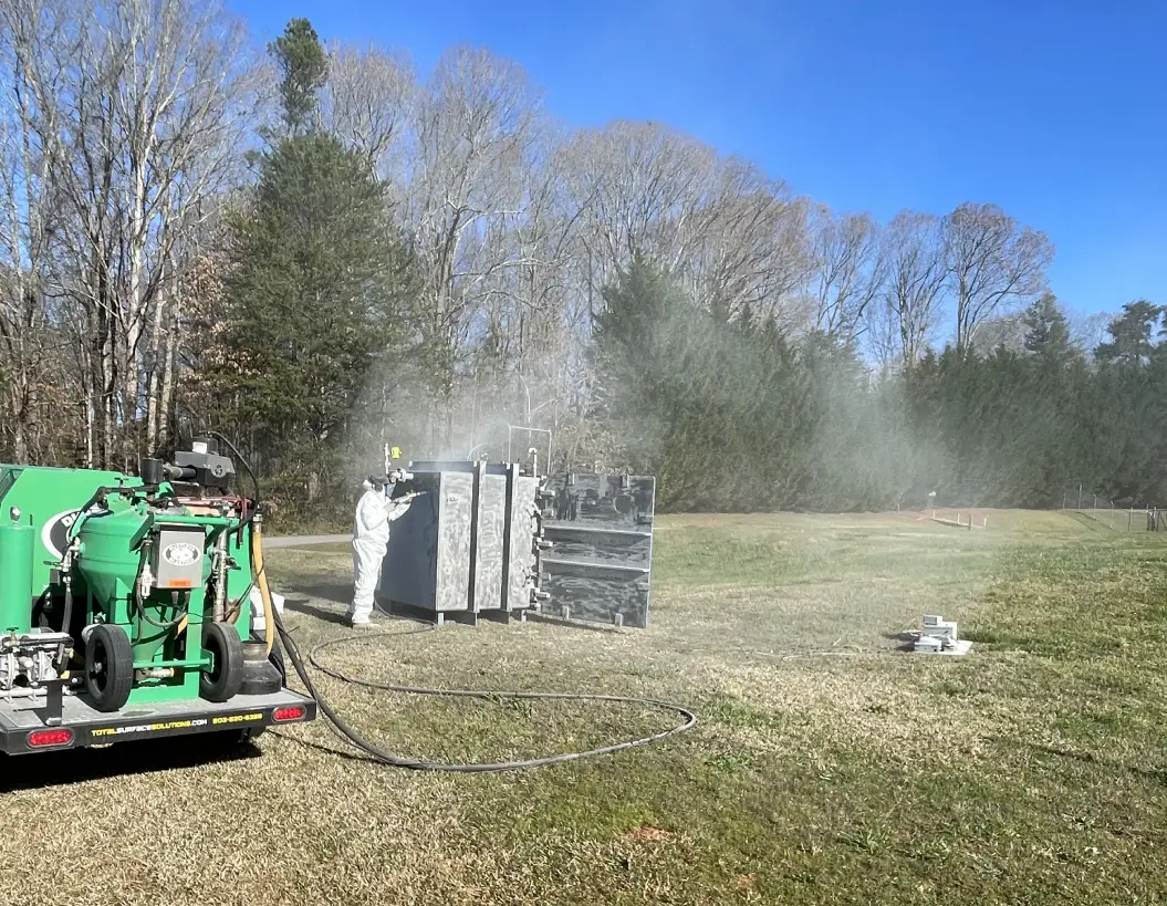 image - 2025-04-18T220436.697 A truck is spraying water on the ground.
